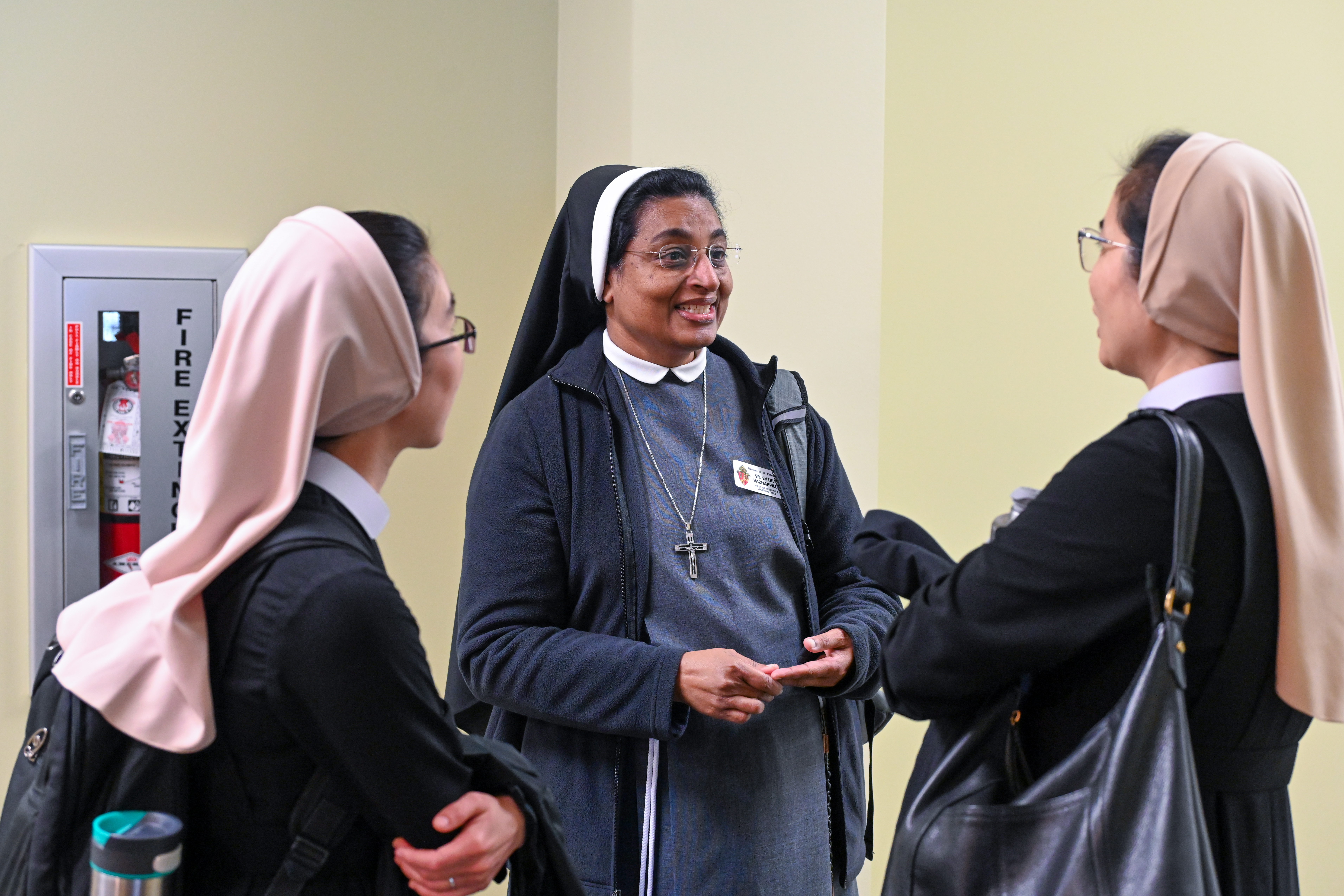 Sister Sherly Vazhappily, Associate Director of Vocations, speaks with other sisters at the Vocations Workshop