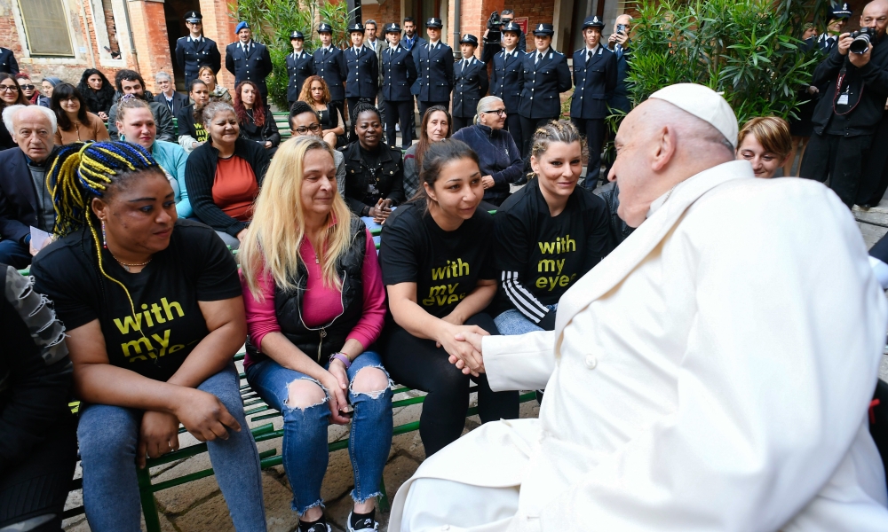 Pope Francis greets female detainees in the courtyard of the Giudecca women's prison in Venice April 28, 2024. | Photo by CNS Photo/Vatican Media.
