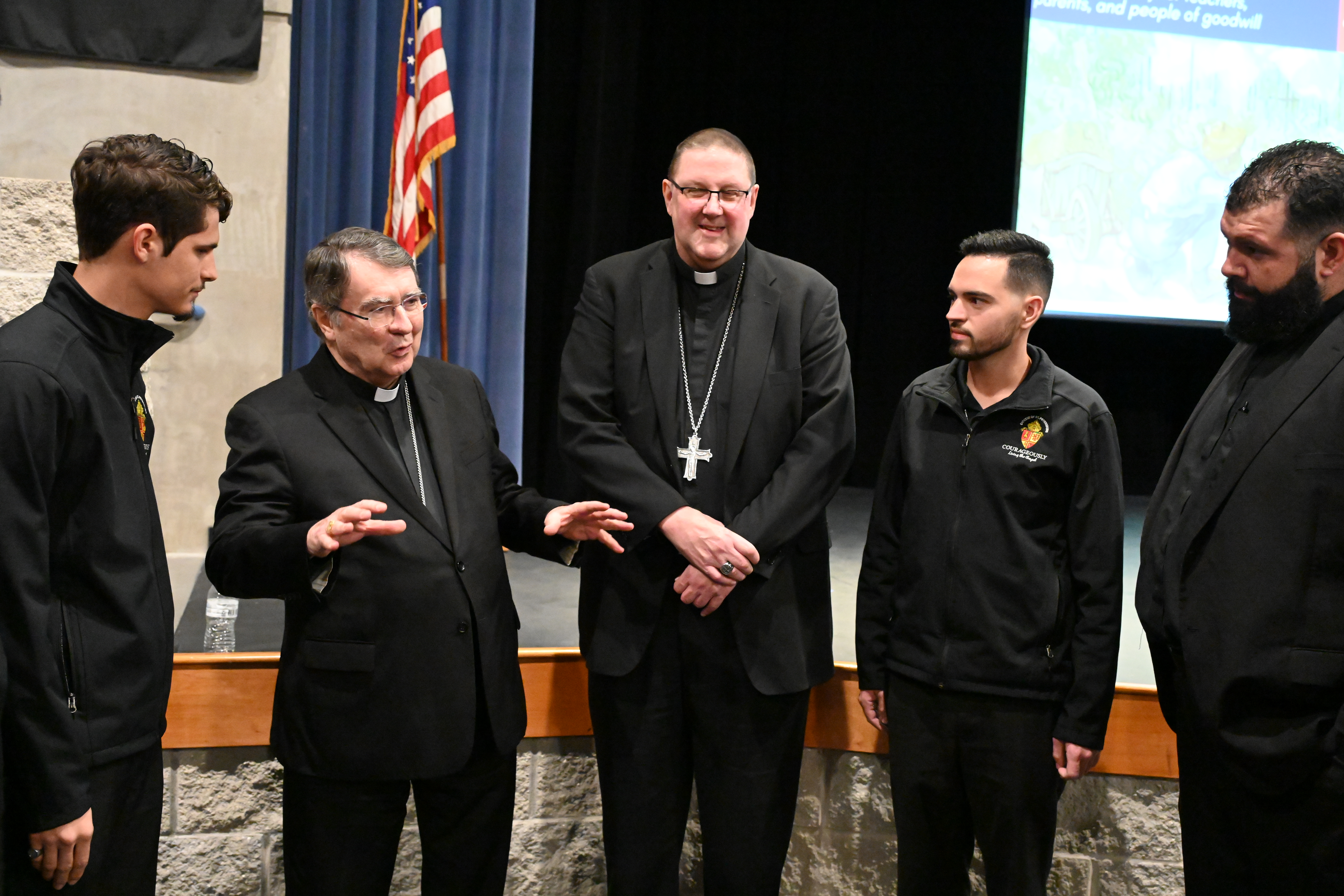 Cardinal Pierre and Bishop Parkes speak with Diocese of St. Petersburg seminarians who attended the panel discussion. Photo by Teresa Peterson.