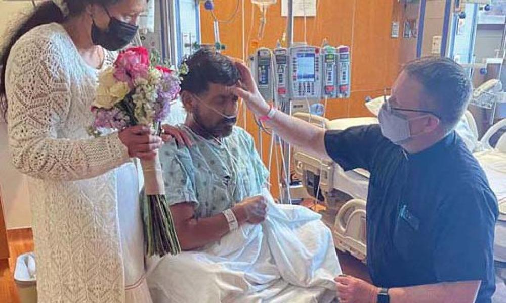 Husband and Wife Receive the Sacrament of Marriage in a Hospital Room