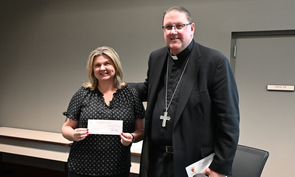 Bishop Parkes and Maggie from Catholic Charities