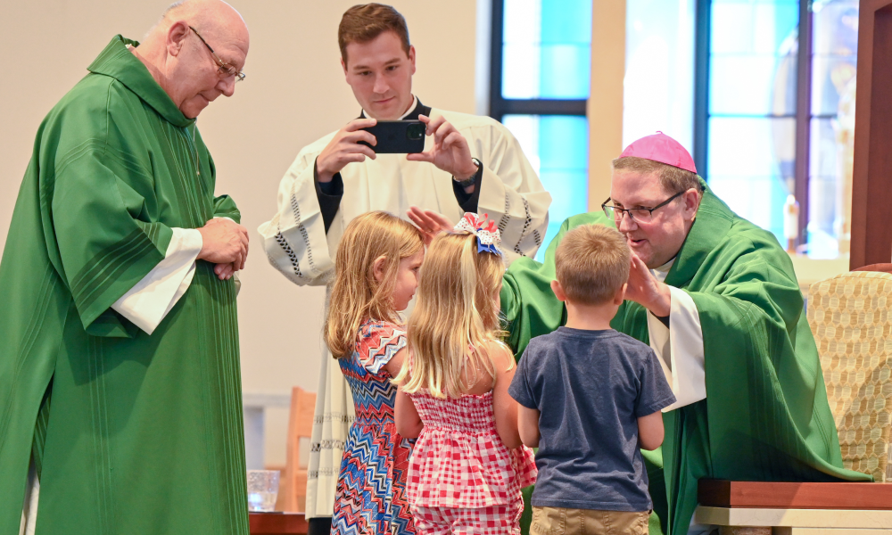Bishop Parkes blessing the students