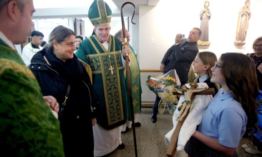 Antonia Salzano, Carlo Acutis' mother, and Bishop David O'Connell speak to schoolchildren at the blessing of the Carlo Acutis shrine at St. Dominic Parish in Brick, New Jersey. Photo by Thomas P. Costello II