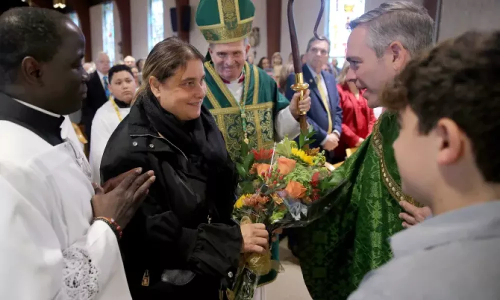 Blessed Carlo Acutis' mother, Antonia Salzano, is greeted by Father Brian Woodrow and Bishop David O'Connell at St. Dominic Parish in Brick, New Jersey. Photo by Thomas P. Costello II
