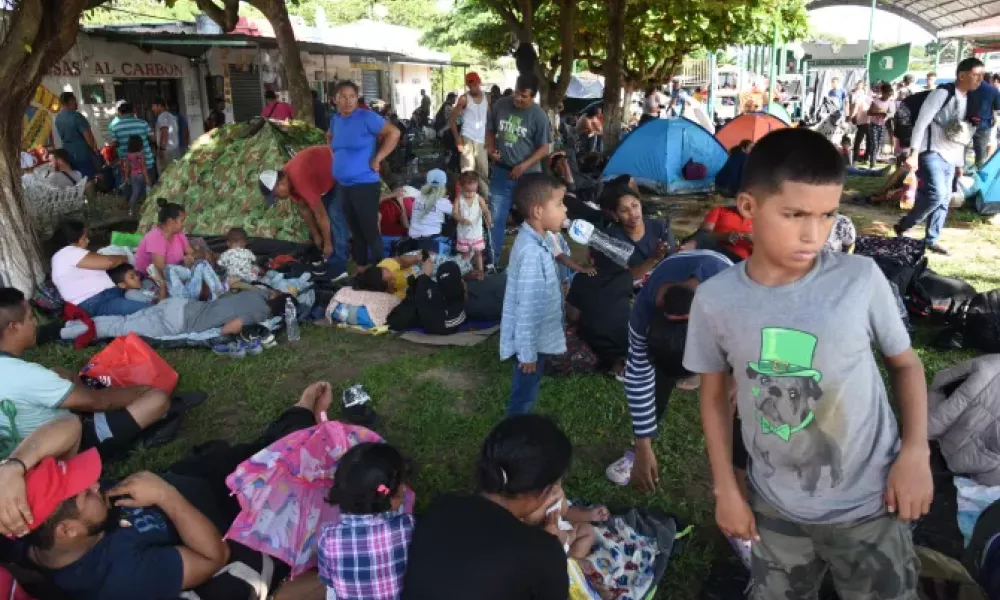 Migrants take a rest while taking part in a caravan toward the border with the United States in Tapachula, Chiapas State, Mexico, on Oct. 31, 2023. | Photo by Isaac Guzman/AFP via Getty Images