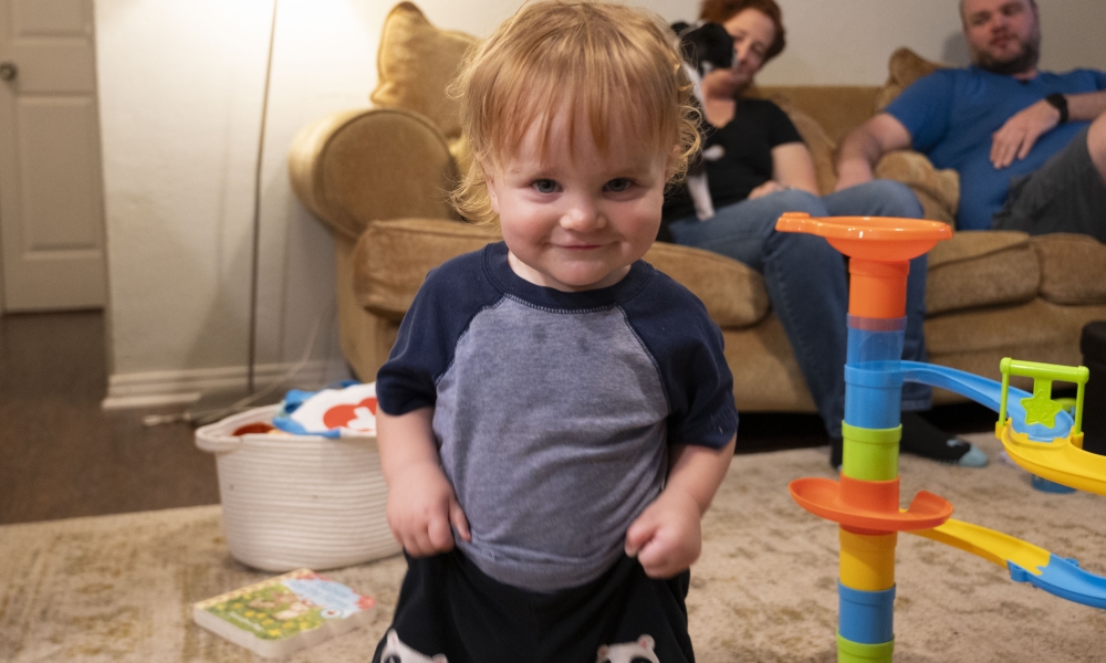 Frank Okey plays in his living room. Photo by Mary McCoy