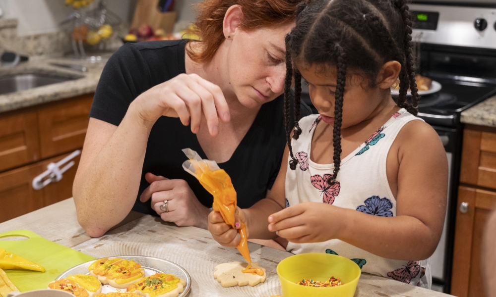 Paige Cargioli and Dorothy decorate cookies. Photo by Mary McCoy