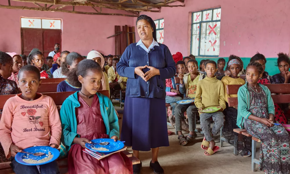 Sister Medhin with school children in Tigray, Ethiopia, in March 2024. The Scotland-based organization Mary’s Meals, which feeds almost 2.5 million children in some of the world’s poorest countries, has been partnering with the Daughters of Charity in Tigray since 2017 to provide meals for thousands of children. | Photo by Armstrong Studios.