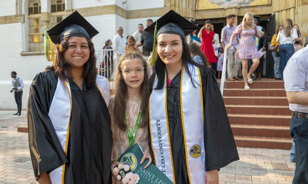 Leticia de Los Ángeles Oliva and Dania Sarai Palencia, who both earned bachelor’s degrees in psychology, and Rosita Vélez, attended Saint Leo University’s Baccalaureate Mass on May 10 in the Saint Leo Abbey Church. | Photo by Renee Gerstein, Saint Leo University.