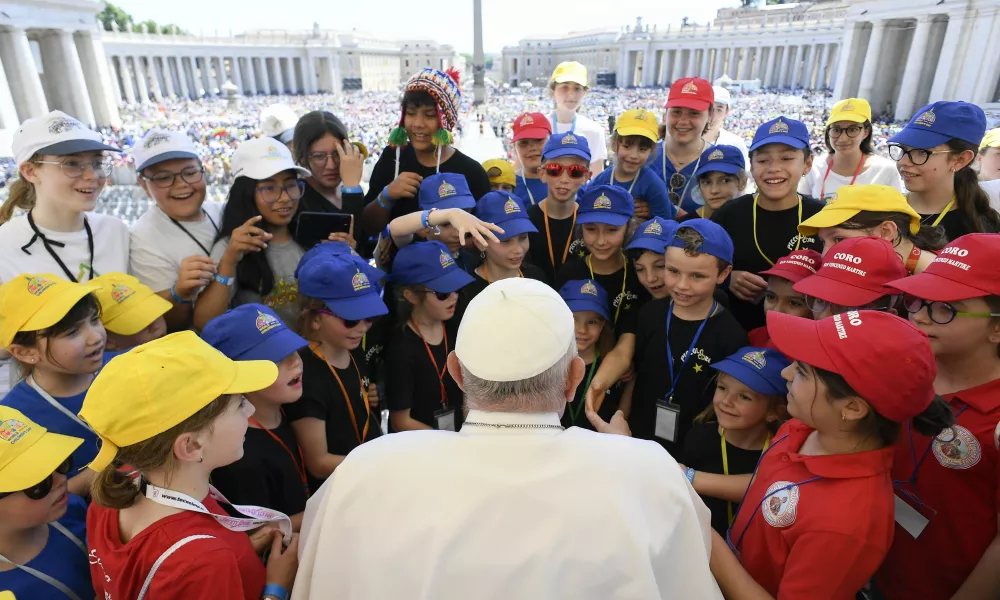 Pope Francis speaks with a group of children in St. Peter's Square in Rome during the first World Day of Children on Sunday, May 26, 2024. | Photo by Daniel Ibañez/CNA