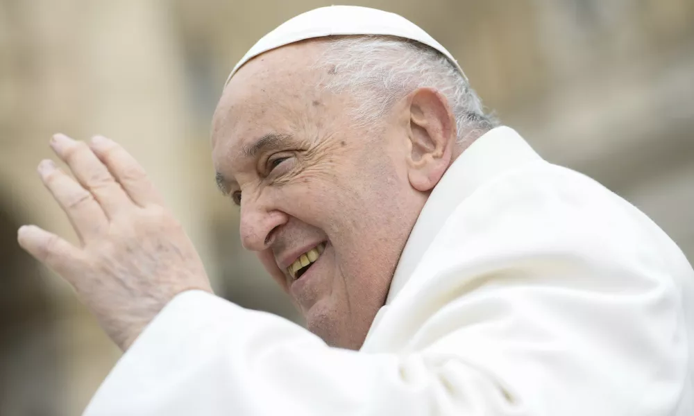 Pope Francis waves to pilgrims in St. Peter's Square gathered for his weekly general audience. | Photo by Vatican Media.