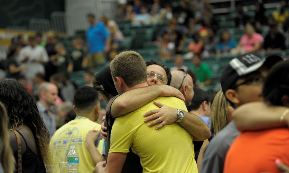 A parent hugs his son goodbye at a past Saint Leo University move-in day.