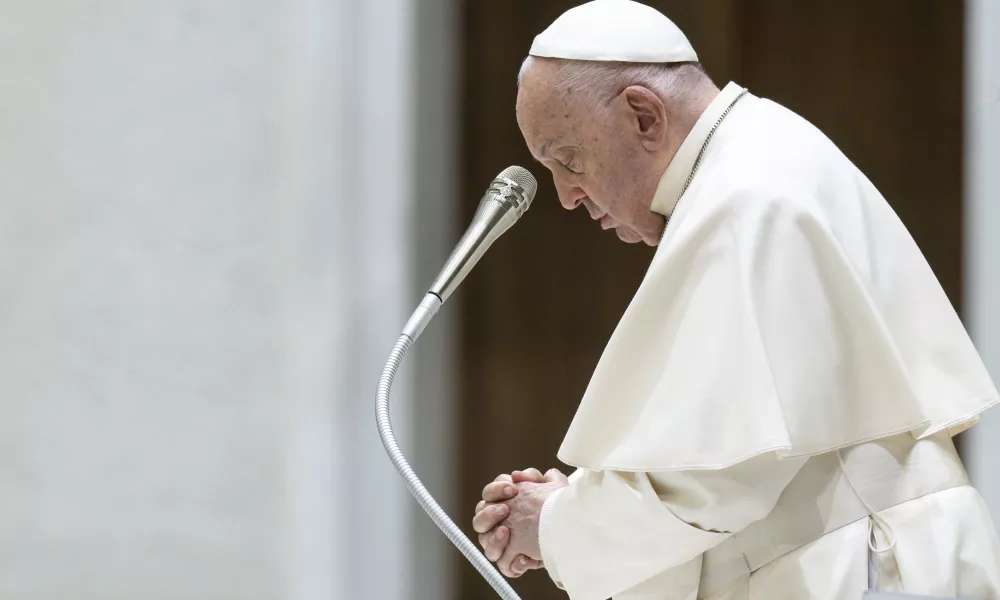 Pope Francis prays during his general audience on Wednesday, May 1, 2024, in Paul VI Hall at the Vatican. | Photo by Vatican Media.