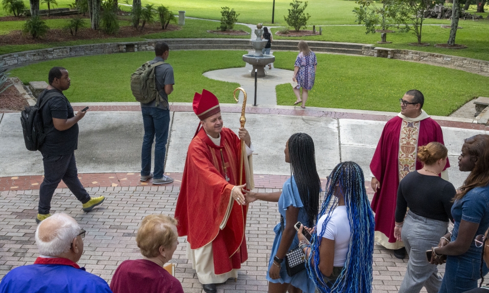 Abbot Isaac Camacho, OSB, greets students following Mass. | Photo by Caroline Jorgensen, Saint Leo University.