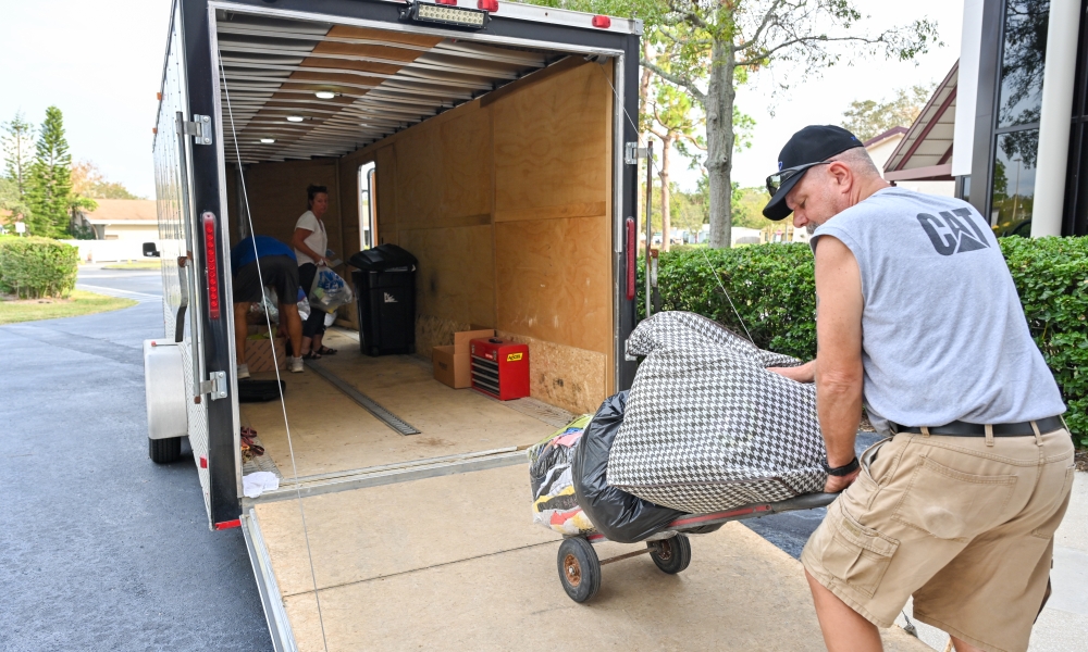 Tim wheels bags of clothing