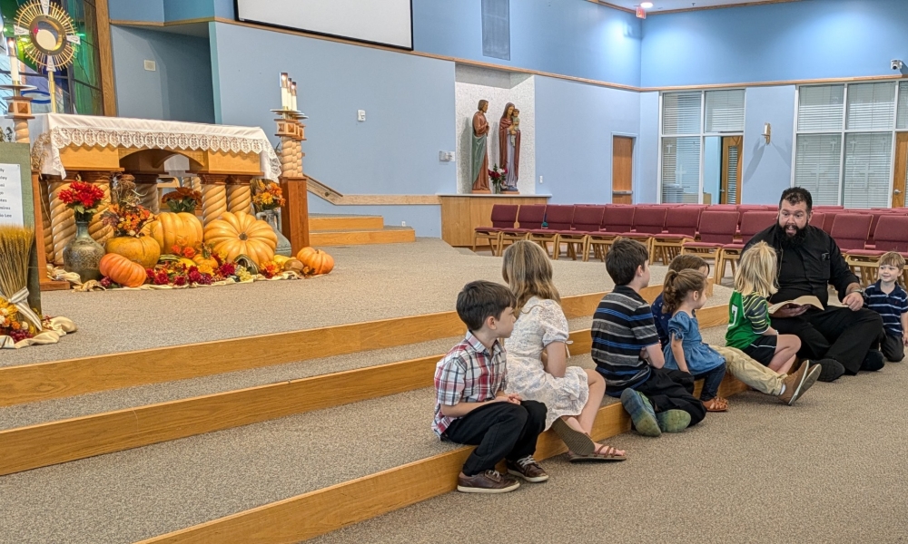 Fr. Chuck Dornquast with children during the families with young children holy hour.