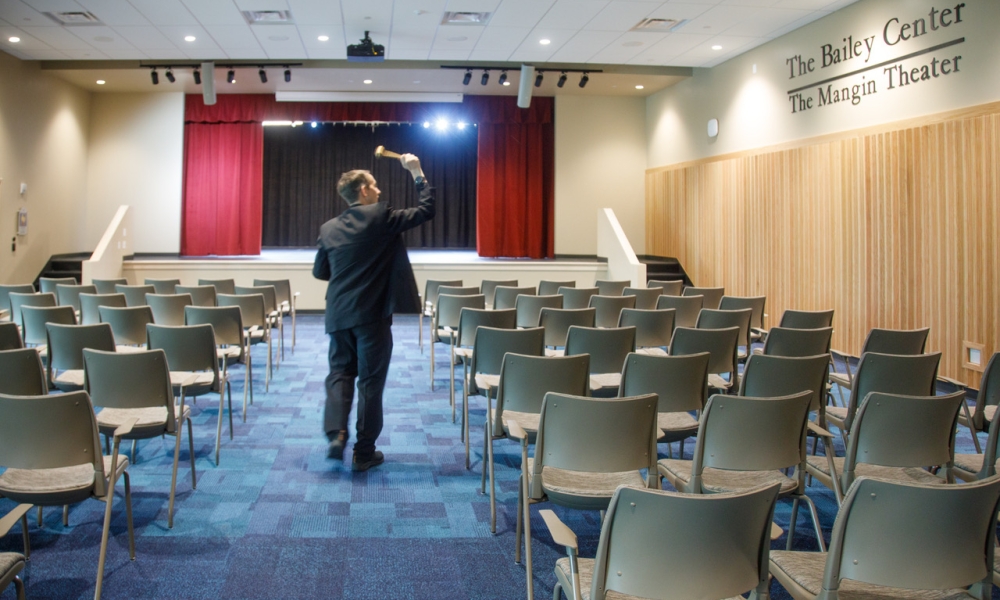 Father Plazewski blesses the theater.