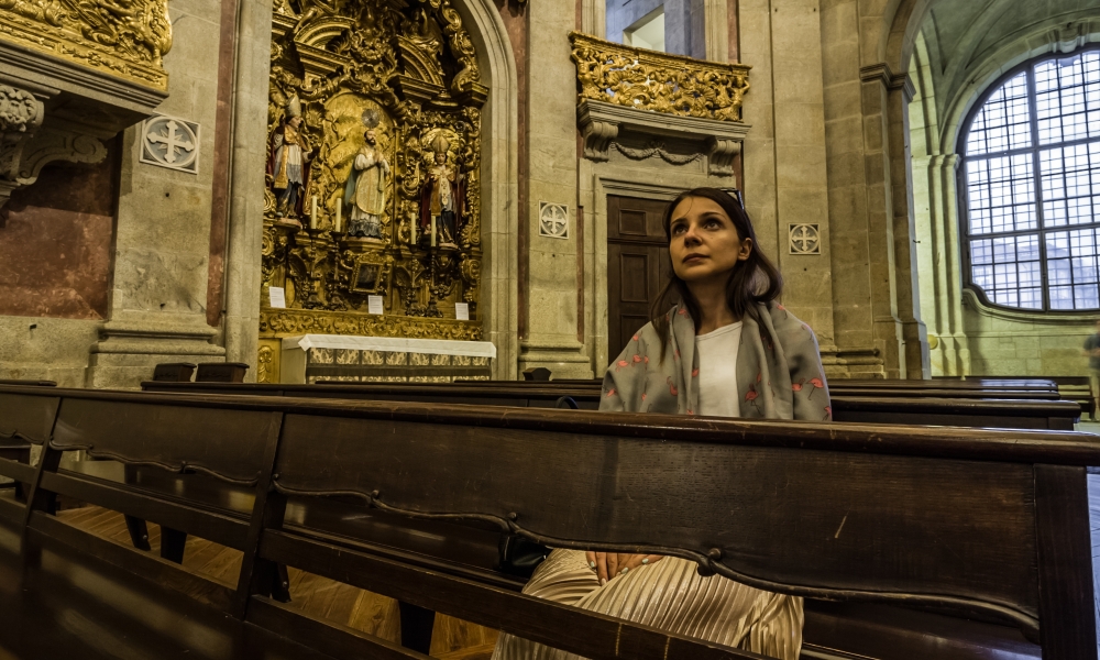 Woman praying in church