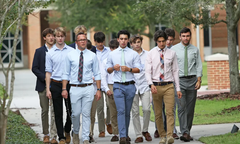 Jimmy Mitchell (front row, far left) leads a group of Jesuit students in a walking rosary after school. | Photo by Jesuit High School