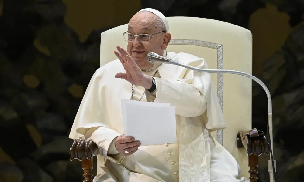 Pope Francis waves to the crowd in the Paul VI Audience Hall at the Vatican during his Wednesday general audience on Jan. 22, 2025. | Photo by Vatican Media