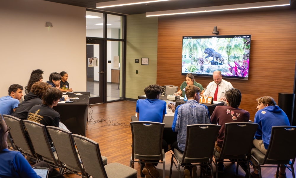 Drs. Marissa Rhodes and Steve Okey and Academy at the Lakes and Jesuit competing in the semifinal round