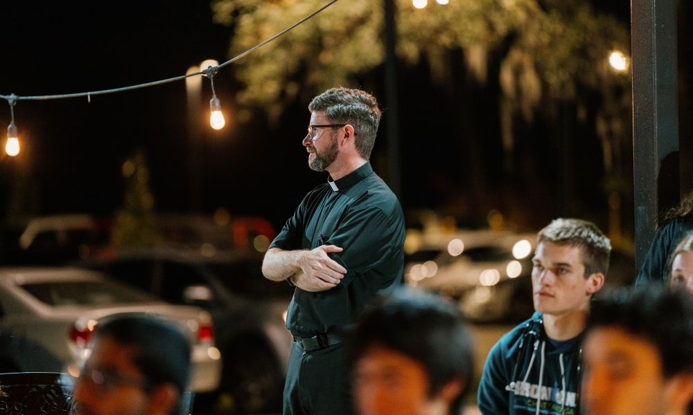 Father Kyle Bell at a Catholic Student Union weekly meeting (Bull's Night). | Courtesy Photo.