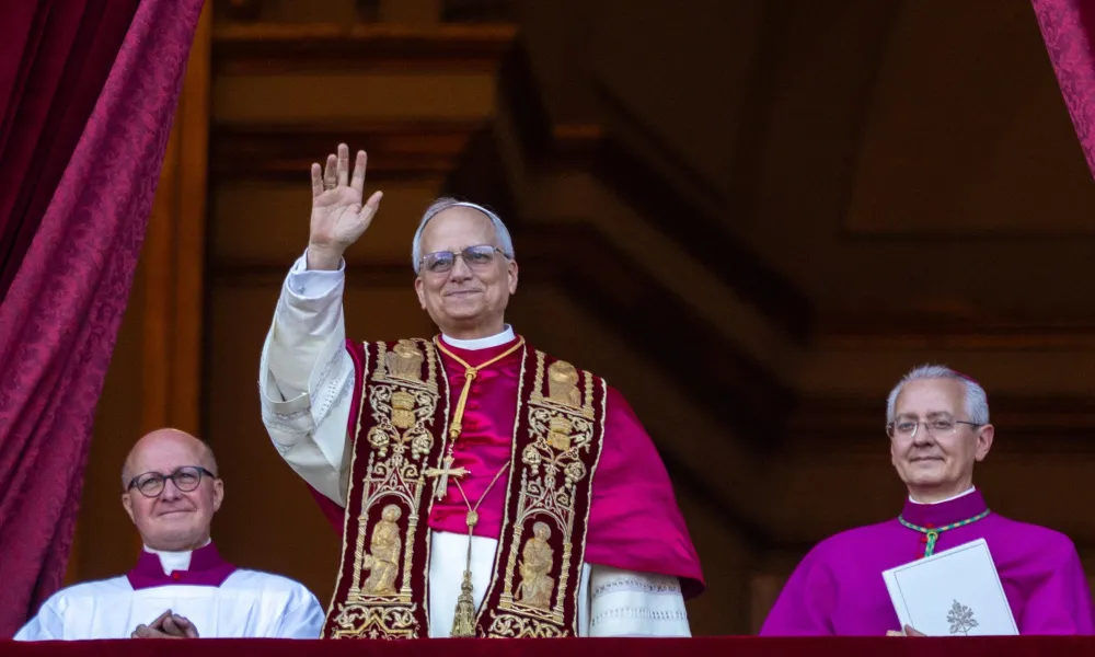 Pope Leo XIV waves to pilgrims in St. Pete’s Square shortly after his election on Thursday, May 8, 2025. Credit: Daniel Ibáñez/CNA