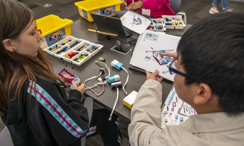 Bao Han, right, works with L.J. Decker on her robot at Saint Leo University.