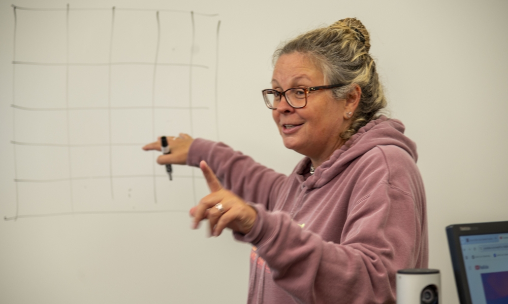 Dr. Monika Kiss explains pixels to camp participants.