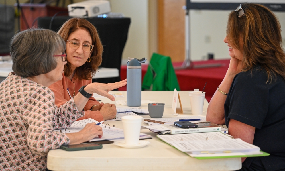 A parish group works together at the Parents and Families at the Center of Faith Formation workshop on May 31, 2025. | Photo by Brittany DeHaan.