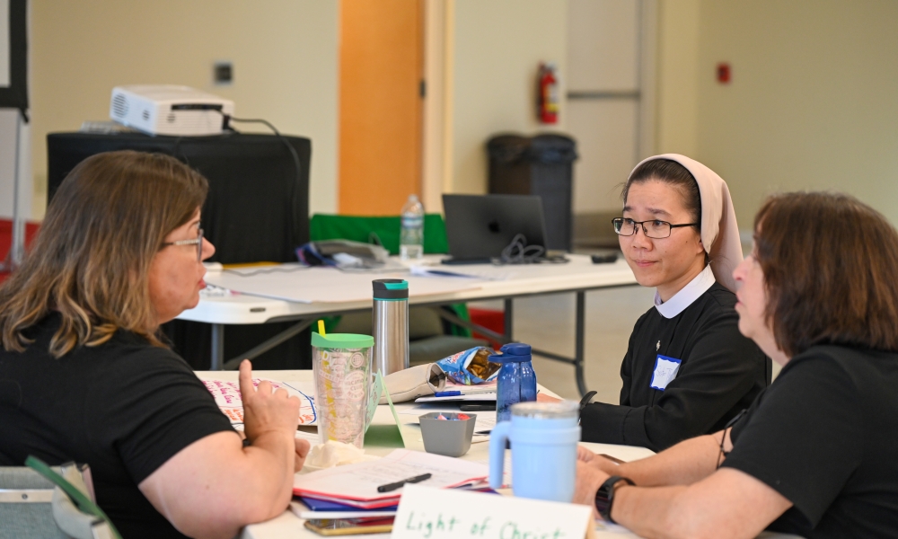 A parish group works together at the Parents and Families at the Center of Faith Formation workshop on May 31, 2025. | Photo by Brittany DeHaan.