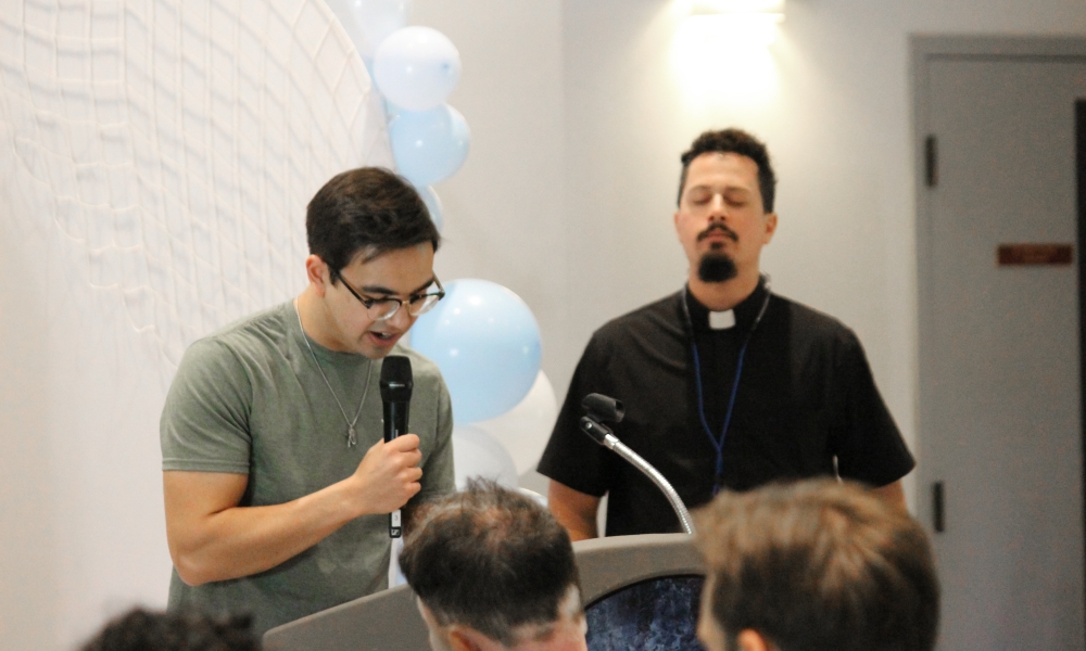Christopher Poole (left) reads Scripture during a Lectio Divina exercise.