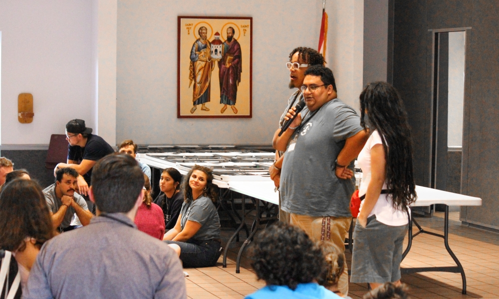 Jacob Guardado (right) leads a group activity.