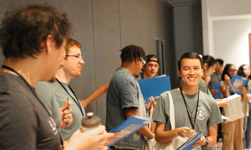 Mark Thivierge (right) talks with friends at the retreat.