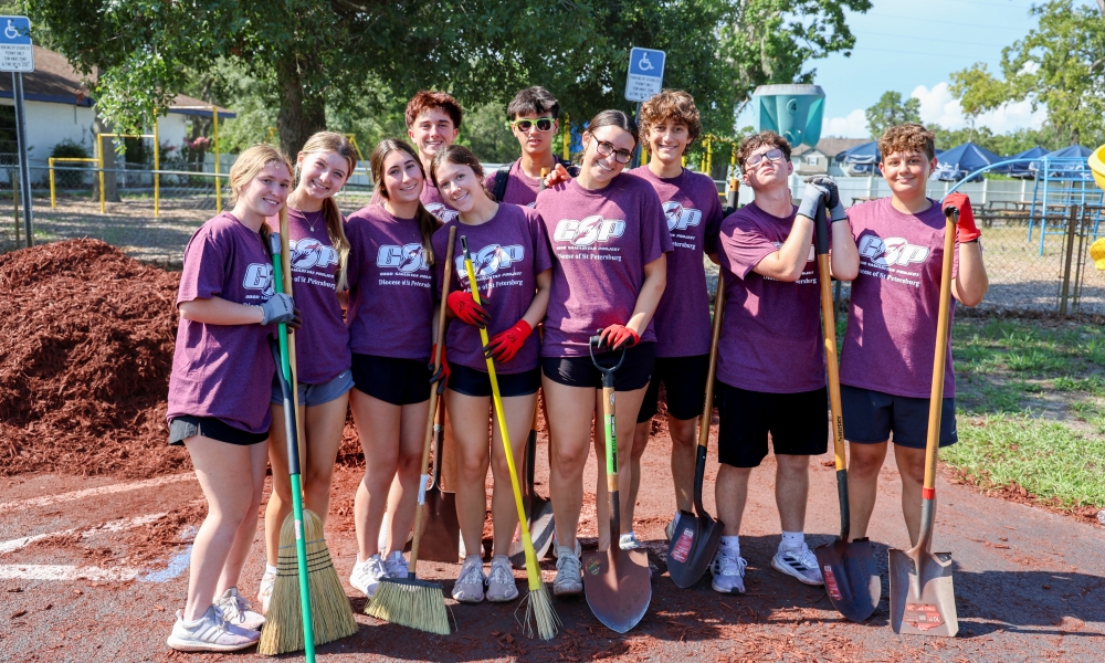 Teens from St. Timothy Catholic Church during one of their service sites at the Good Samaritan Project at Notre Dame Catholic Church, where they worked on landscaping to beautify the grounds. | Photo by Keishla Espinal