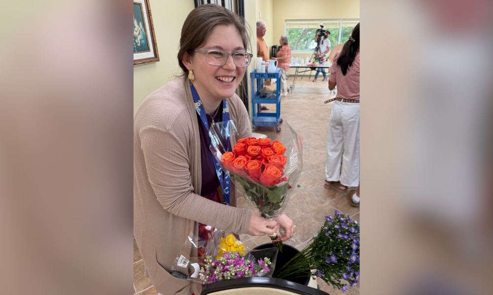 A participant gathers flower options for the bouquets.