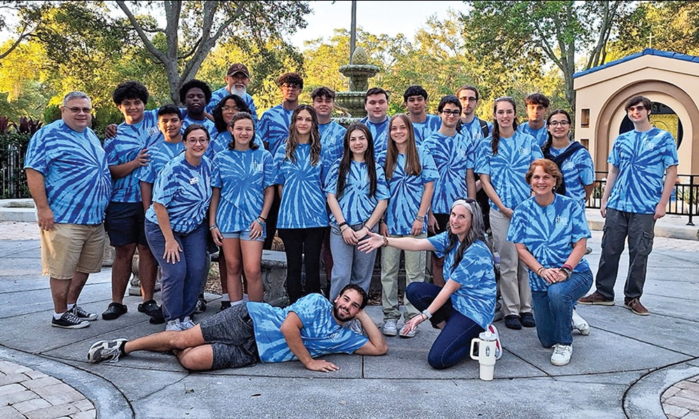 Father Craig Morley (far left) photographed with the St. Paul Tampa Catholic Church youth group