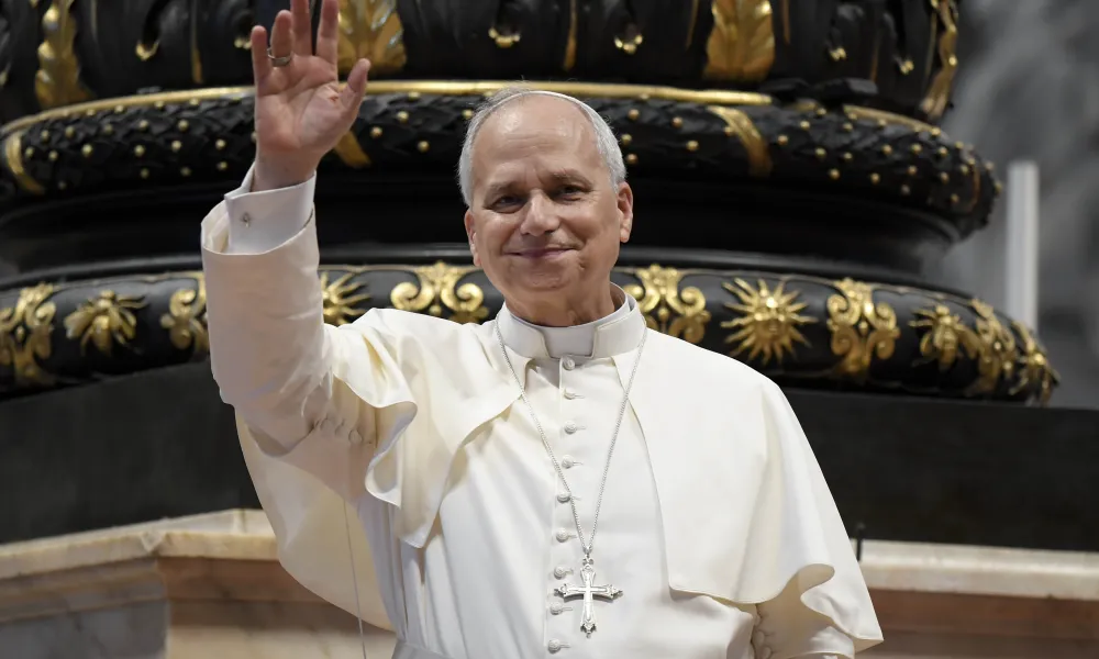 Pope Leo XIV waves to the crowd at his Wednesday general audience in St. Peter’s Basilica on Aug. 13, 2025.