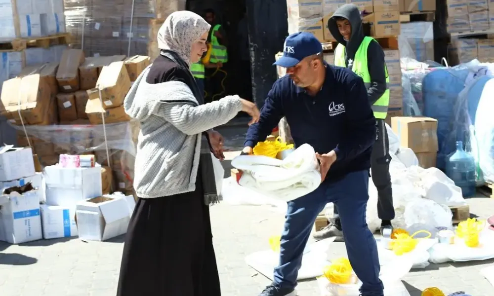 CRS and partners distribute food kits and vital bedding and shelter supplies, including tarps and rope, in Gaza. Despite staggering challenges, CRS and partners have reached provided vital relief across Gaza and the West Bank--reaching 1.78 million between October 2023 and August 2025 alone.
