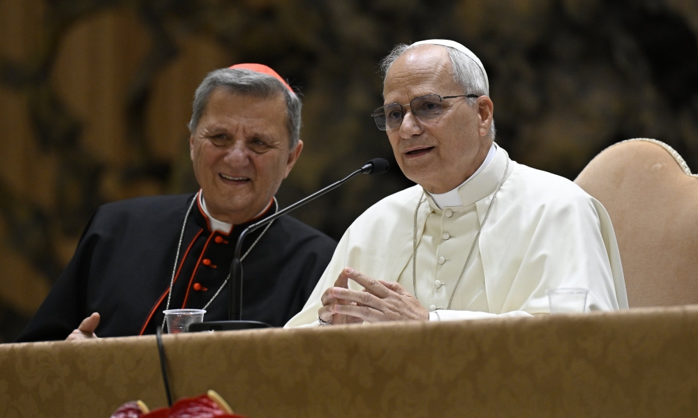 Pope Leo XIV, with Cardinal Mario Grech, secretary-general of the Synod of Bishops, listens to and answers questions from participants in the Jubilee of Synodal Teams and Participatory Bodies in the Vatican audience hall Oct. 24, 2025. (CNS photo/Vatican Media)