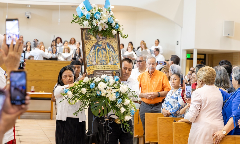 Members of the diocese process with the image of Our Lady of the Rosary.
