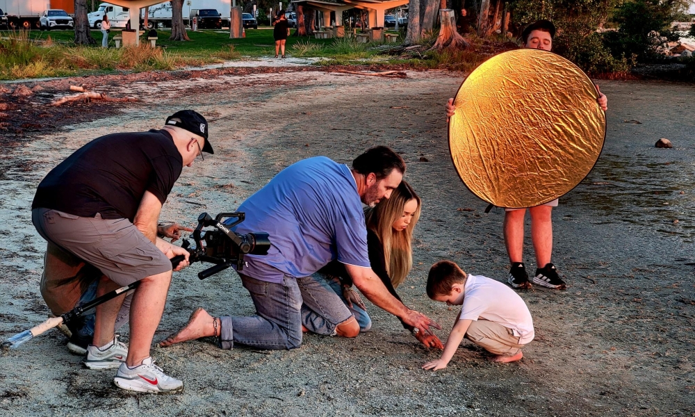 Jeff and his family record on the beach for his movie.