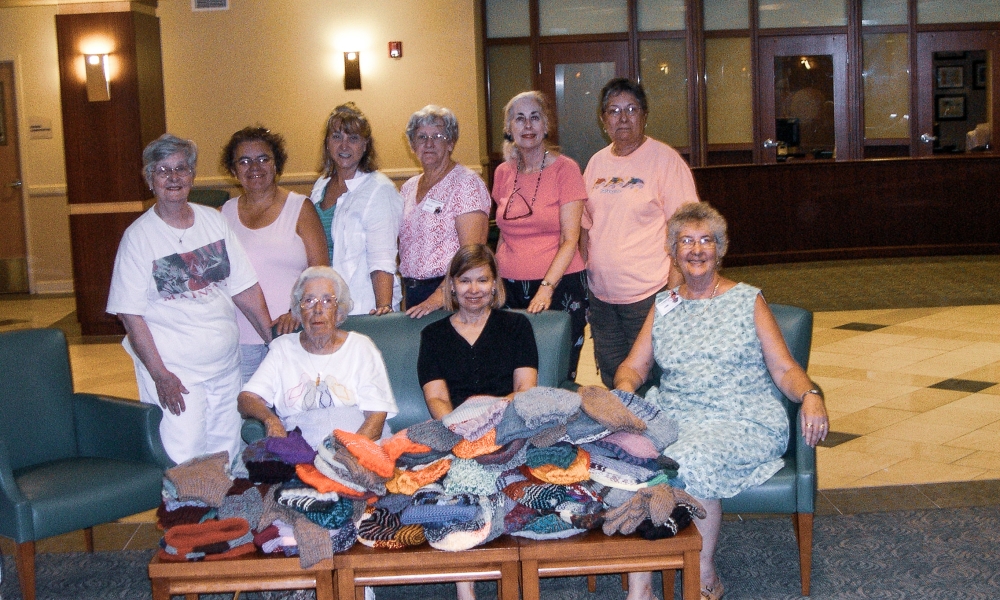 Judy Cuniff and parishioners knitting chemo caps