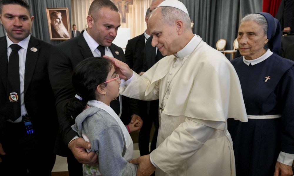 Pope Leo XIV blesses a child at the De La Croix Hospital for the mentally disabled in Jal el Dib, north of Beirut, Lebanon, on Dec. 2, 2025. | Credit: Vatican Media