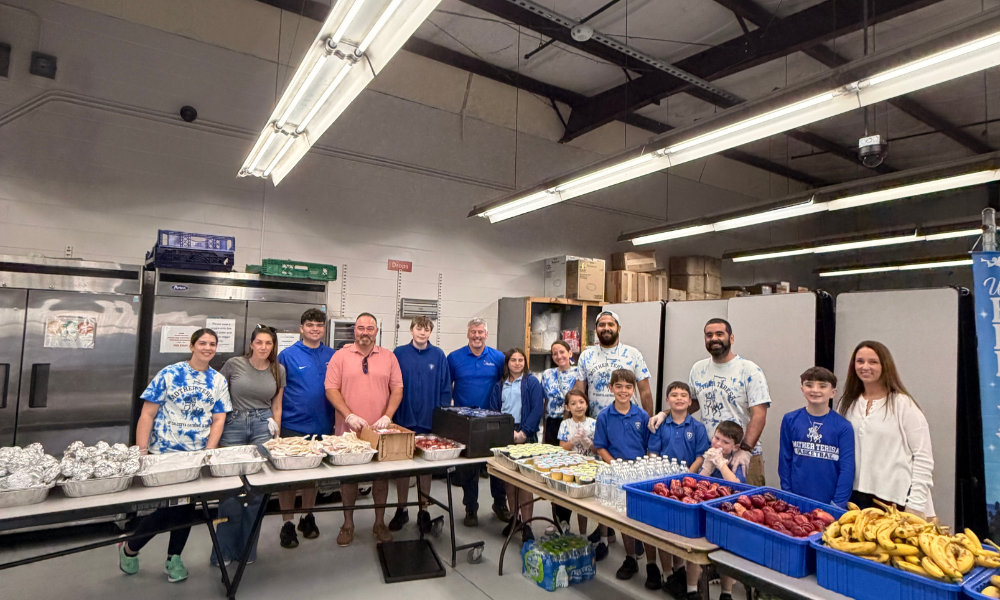 Students, parents, and volunteers from Mother Teresa of Calcutta Catholic School, alongside Maschio’s Food Services, prepare and serve meals at Tampa Hope as part of their Lenten commitment to prayer, sacrifice, and service to those in need. 