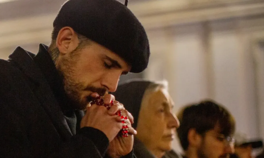 The faithful pray the rosary at St. Peter’s Basilica. | Credit: Daniel Ibañez/EWTN News