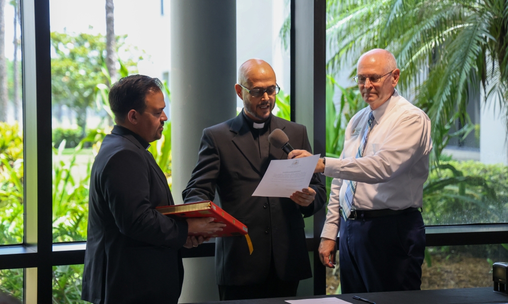 Father Francisco Hernandez takes the Oath of Fidelity. Photo by Allison Munden.