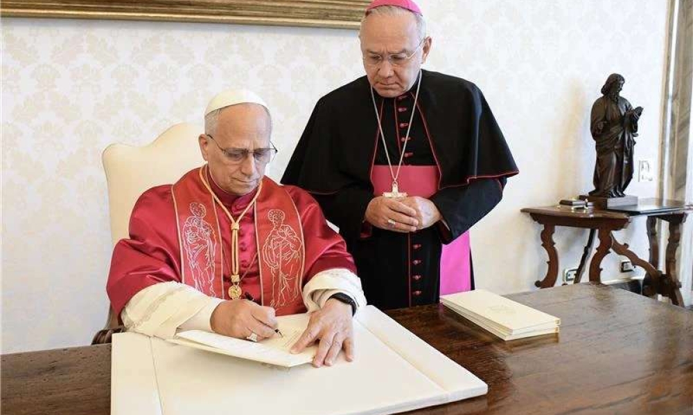 Pope Leo XIV signs his first apostolic exhortation, “Dilexi Te,” on Saturday, Oct. 4, 2025, at the Vatican. | Credit: Vatican Media