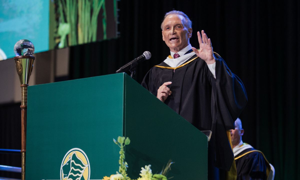 Arnie Bellini addresses graduates at 2026 Saint Leo University commencement.