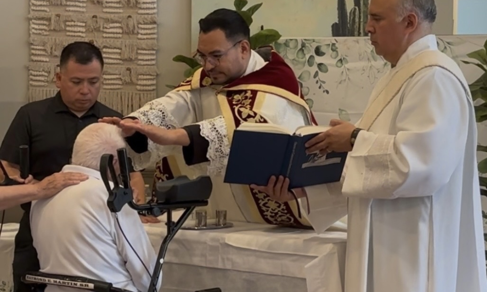 Father Edson Elizarraras, pastor of St. Christopher in Marana, Arizona, gives Raymond Martin a blessing. | Credit: Photo courtesy of Deacon Jack Trevino
